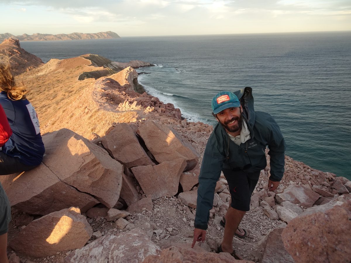 Jake Ross examining an ignimbrite outcrop on an island in the Sea of Cortez